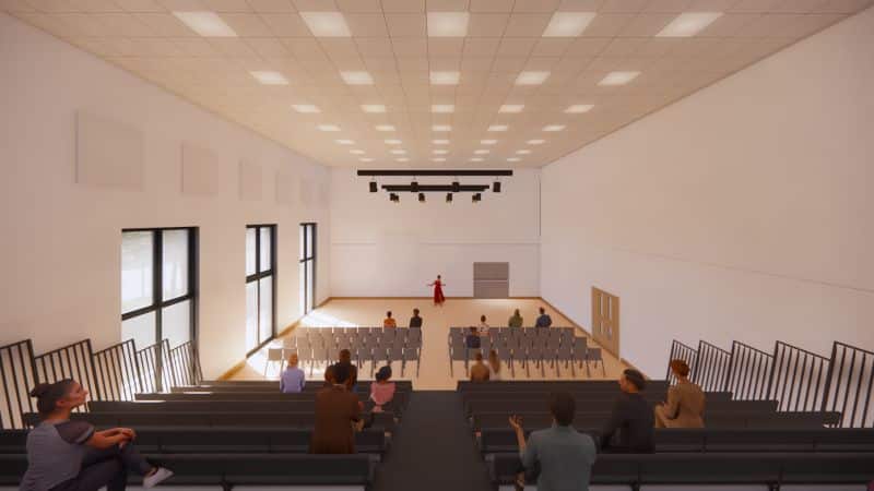 Visual of a lecture theatre looking down at the seats and floor space